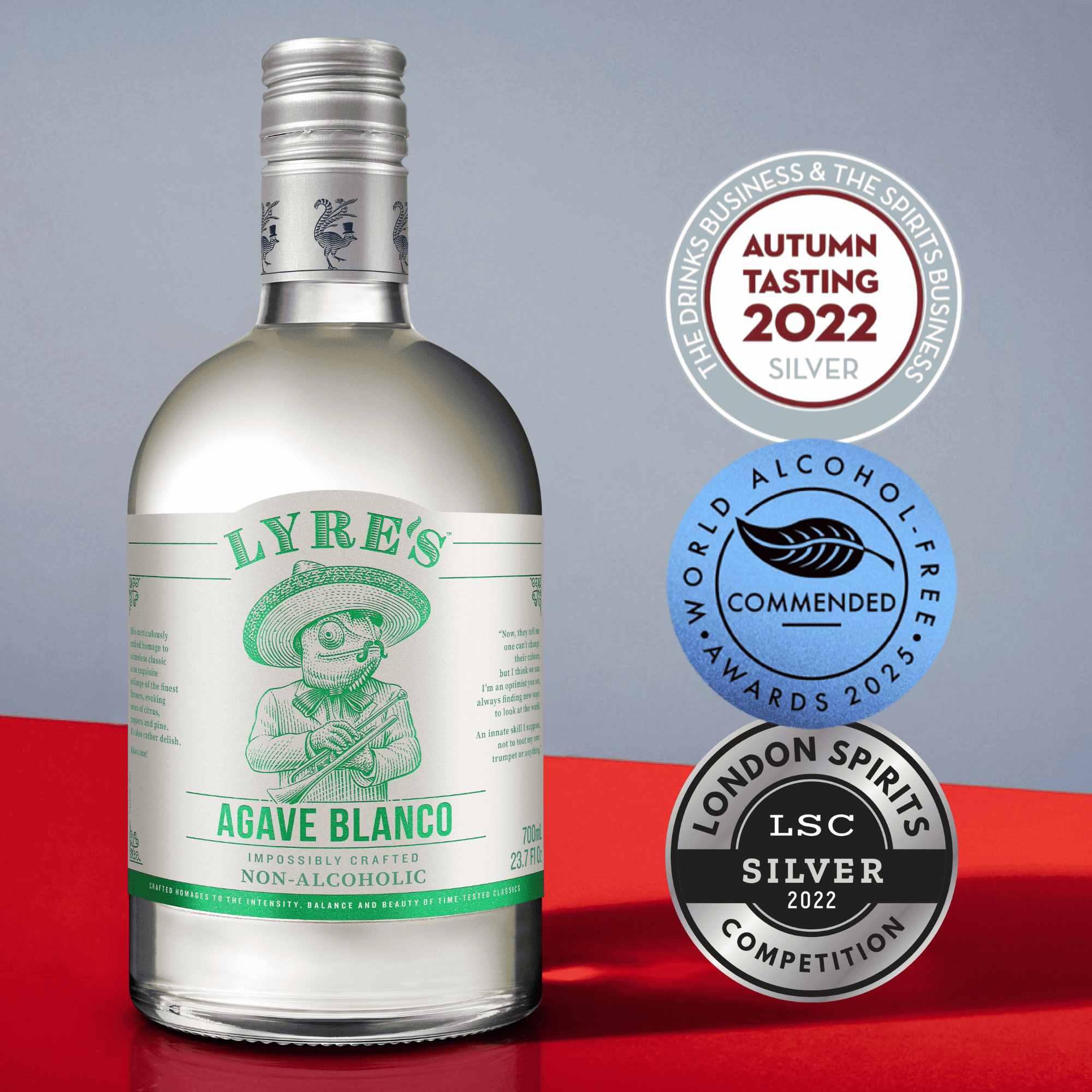 Lyre's Agave Blanco non-alcoholic spirit bottle with awards on a red and gray background