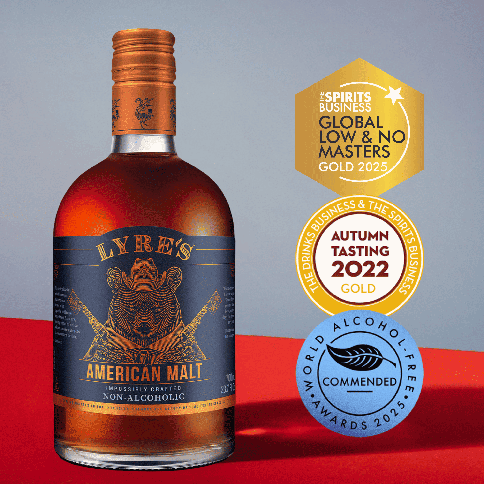 Bottle of Lyre's American Malt non-alcoholic liquor with awards on a red and gray background
