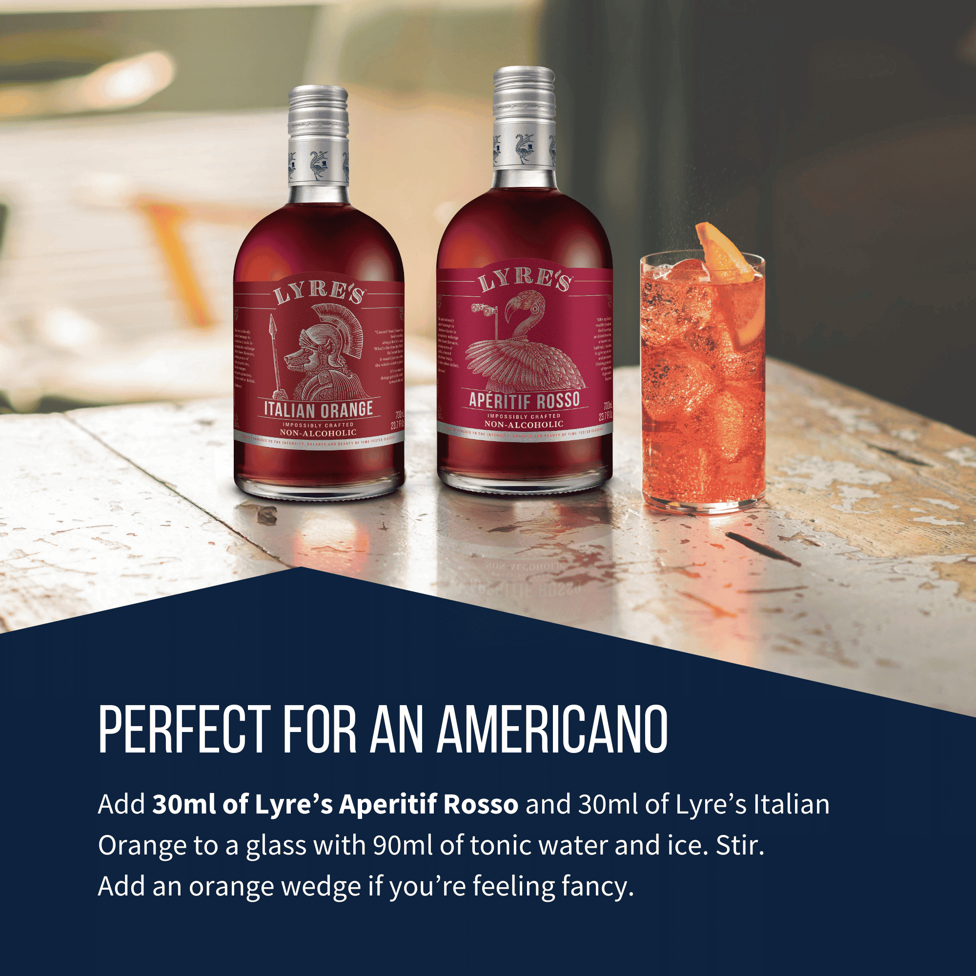 Two bottles of Lyre's Aperitif Rosso and Italian Orange with an Americano cocktail on a bar counter.