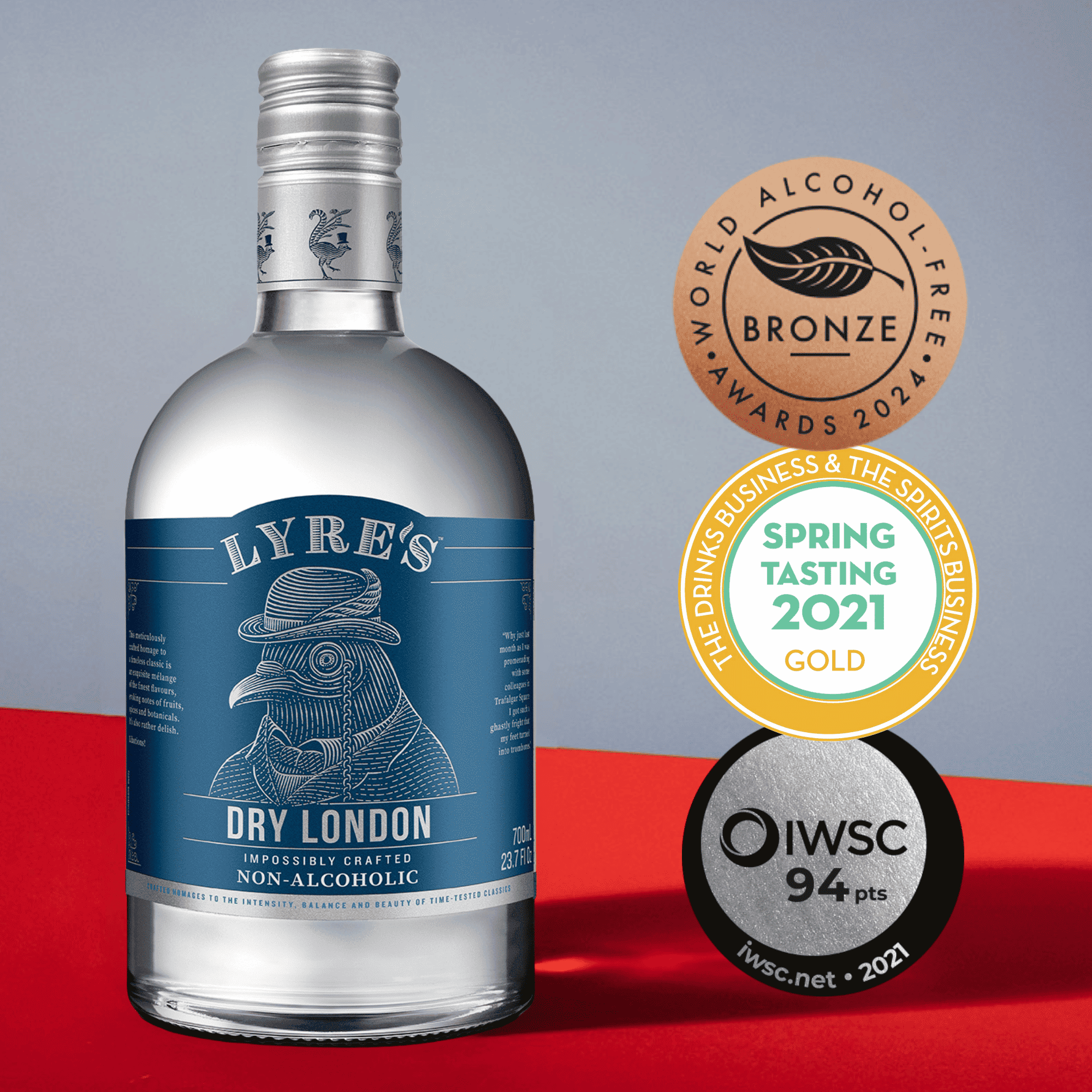 Bottle of Lyre's Dry London non-alcoholic with awards on a red and gray background
