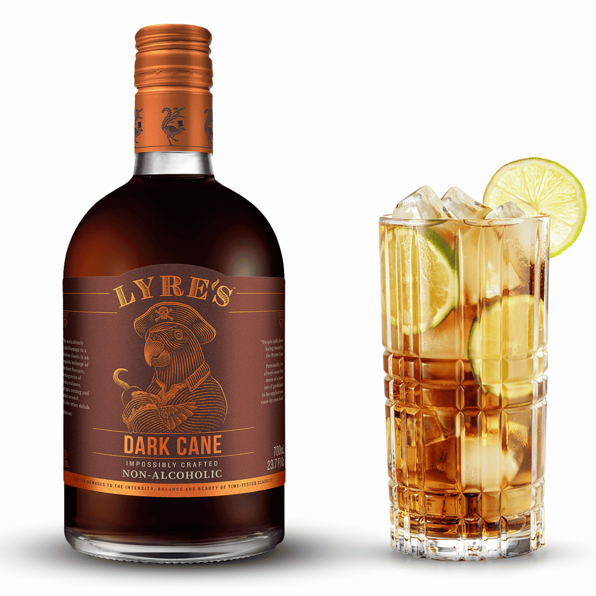 Bottle of Lyres Dark Cane non-alcoholic drink with a glass of a Cube Libre garnished with lime.